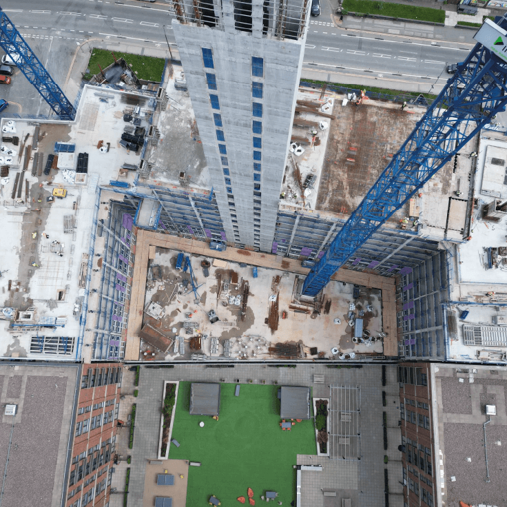 birds eye view of a large residential tower block mid-construction